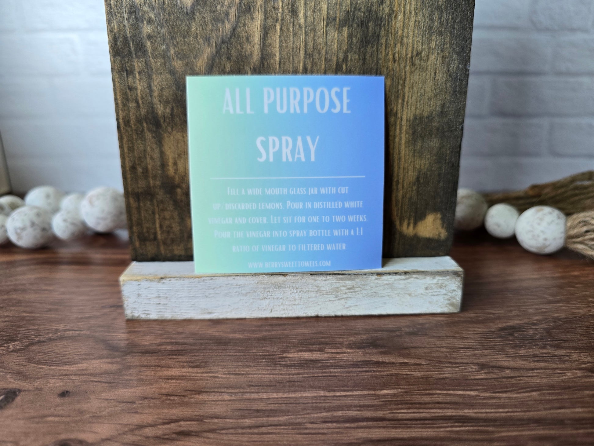 Square vinyl sticker with white text on a green and blue background labeled “All Purpose Spray,” featuring instructions for a citrus-infused vinegar cleaning spray with a 1:1 vinegar to filtered water ratio.