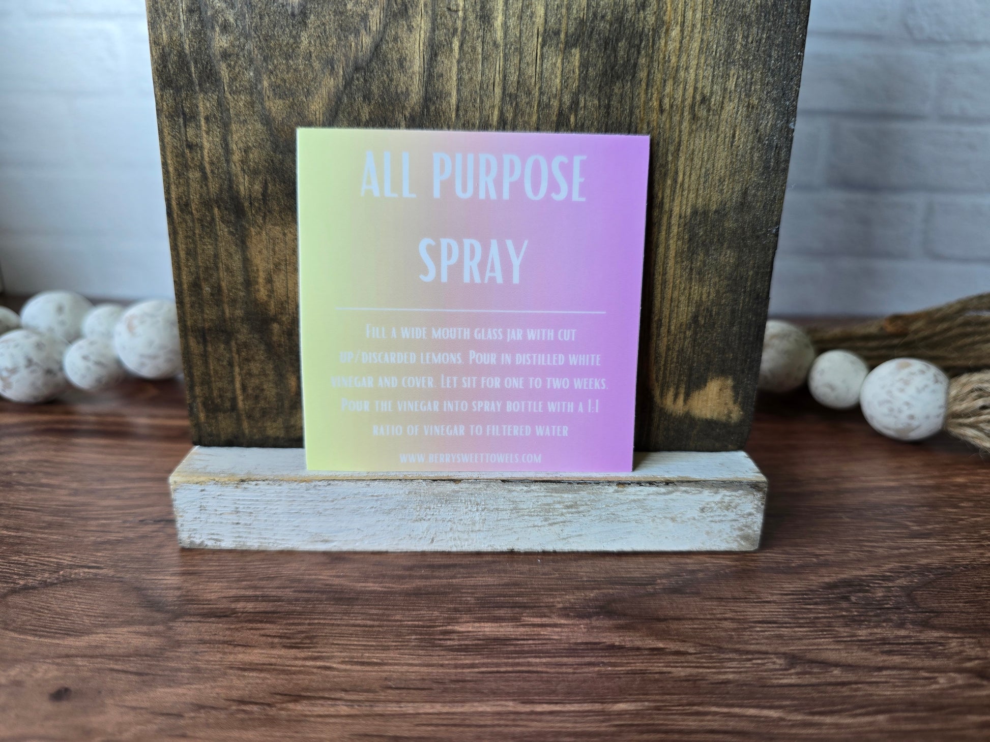 Square vinyl sticker with white text on a yellow and pink background labeled “All Purpose Spray,” featuring instructions for a citrus-infused vinegar cleaning spray with a 1:1 vinegar to filtered water ratio.