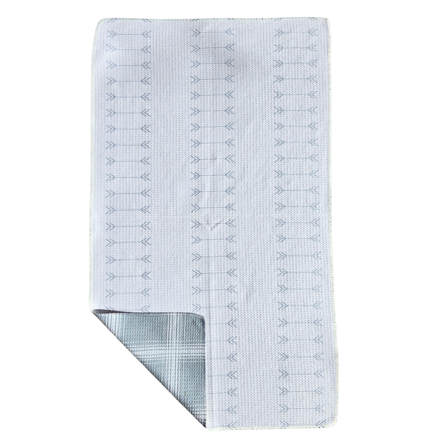 Full view of a waffle weave microfiber hand towel with cream background and rows of gray arrow pattern on the front, with a folded corner revealing the gray and cream plaid reverse side.