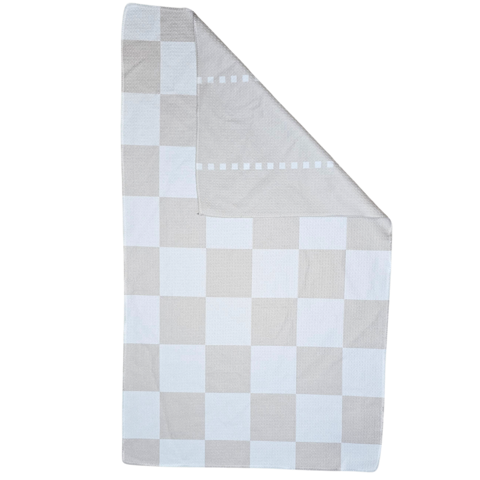 Double-sided waffle weave microfiber hand towel laid flat, featuring a beige and white checkered pattern on the front, with a folded corner revealing the light beige reverse side with vertical square dotted stripe accents.