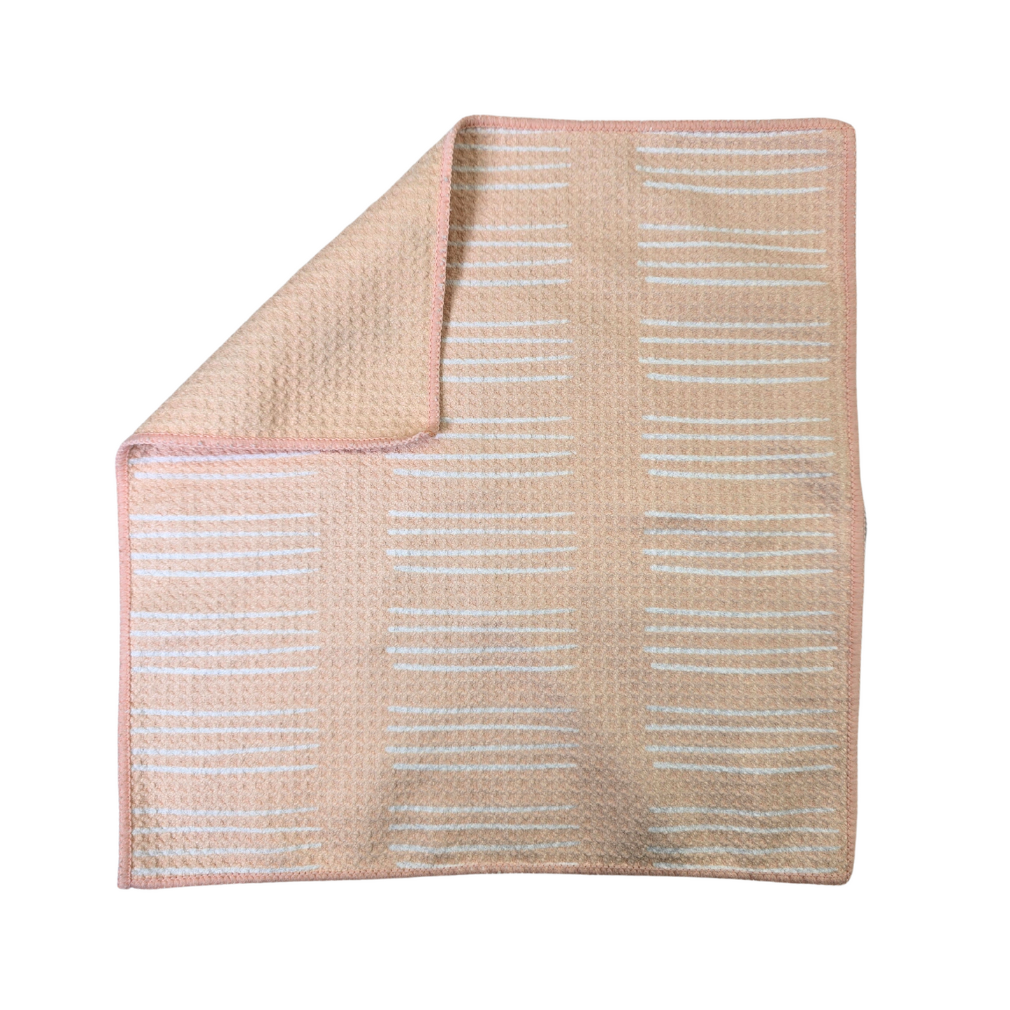 Soft-yellow waffle weave microfiber washcloth laid flat with white horizontal stripe pattern visible on the front side and a corner folded over to show the solid yellow reverse side.